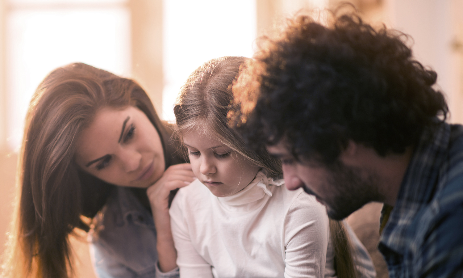 family comforting child