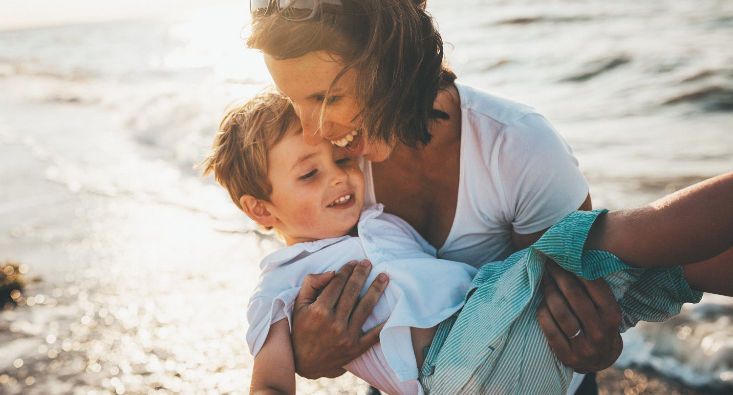 mom with son on beach